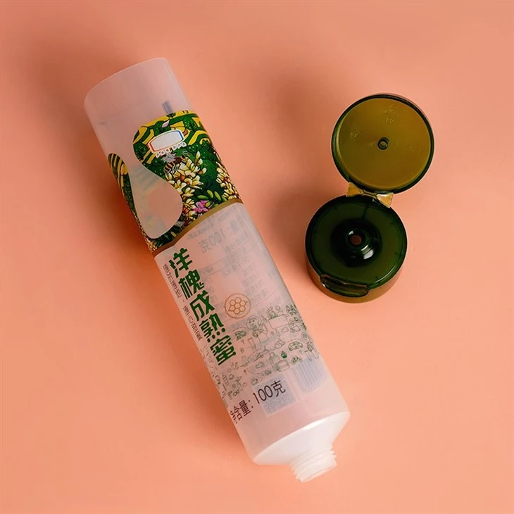 100g Custom Logo Cosmetic Packaging Squeeze Cosmetic Squeeze Container Plastic Food Grade Honey Packaging Tube