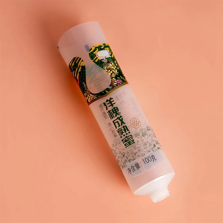 100g Custom Logo Cosmetic Packaging Squeeze Cosmetic Squeeze Container Plastic Food Grade Honey Packaging Tube
